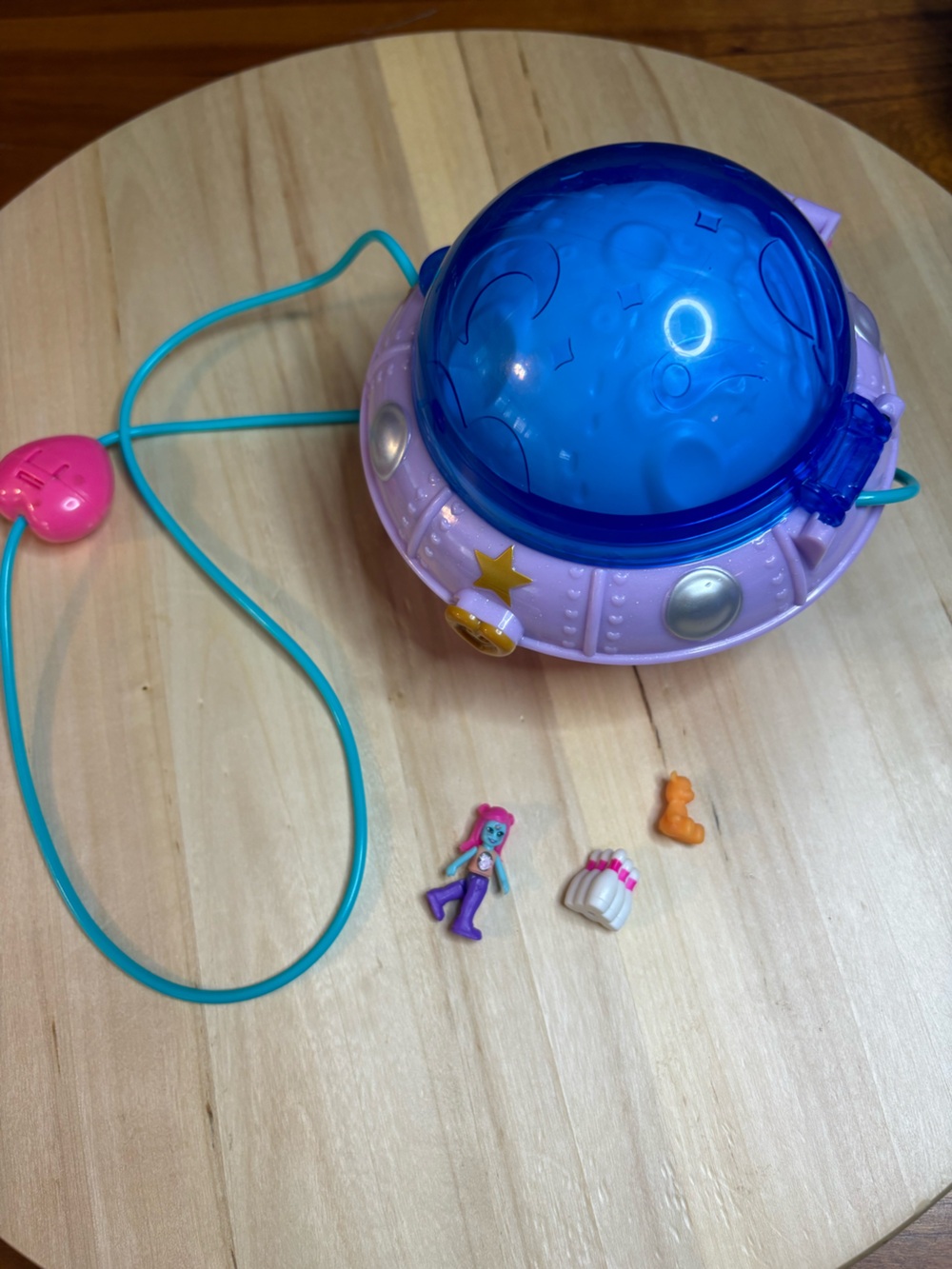 Polly Pocket Double Play Space Compact with a carrying strap